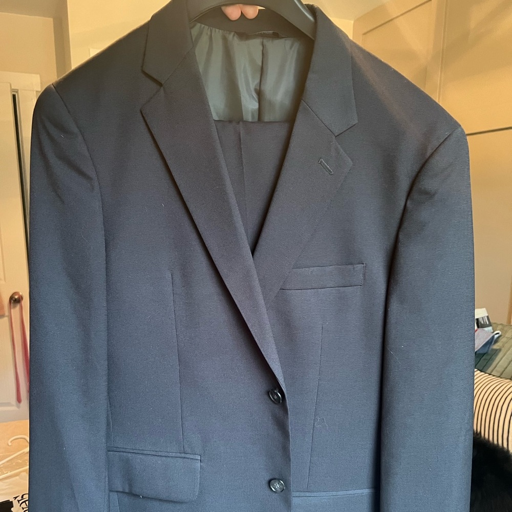 40R suit top & 32 waist suit pants. Dark blue suit only worn once basically new.